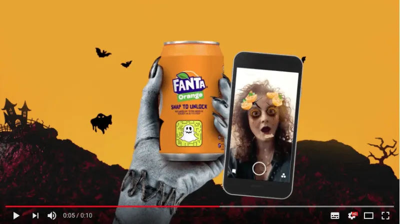 A zombie hand is holding a Fanta can and a woman is using a snapchat Halloween filter.