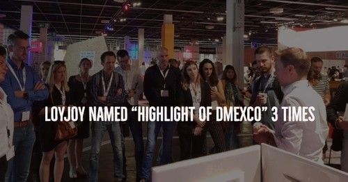 A crowd of people at a fair listening to our CEO Ulf Loetschert.