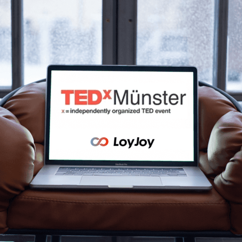 A notebook on a sofa with the TEDxMünster tab open.