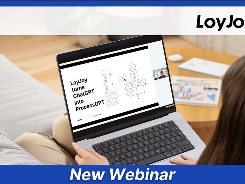A woman watching a webinar on her laptop